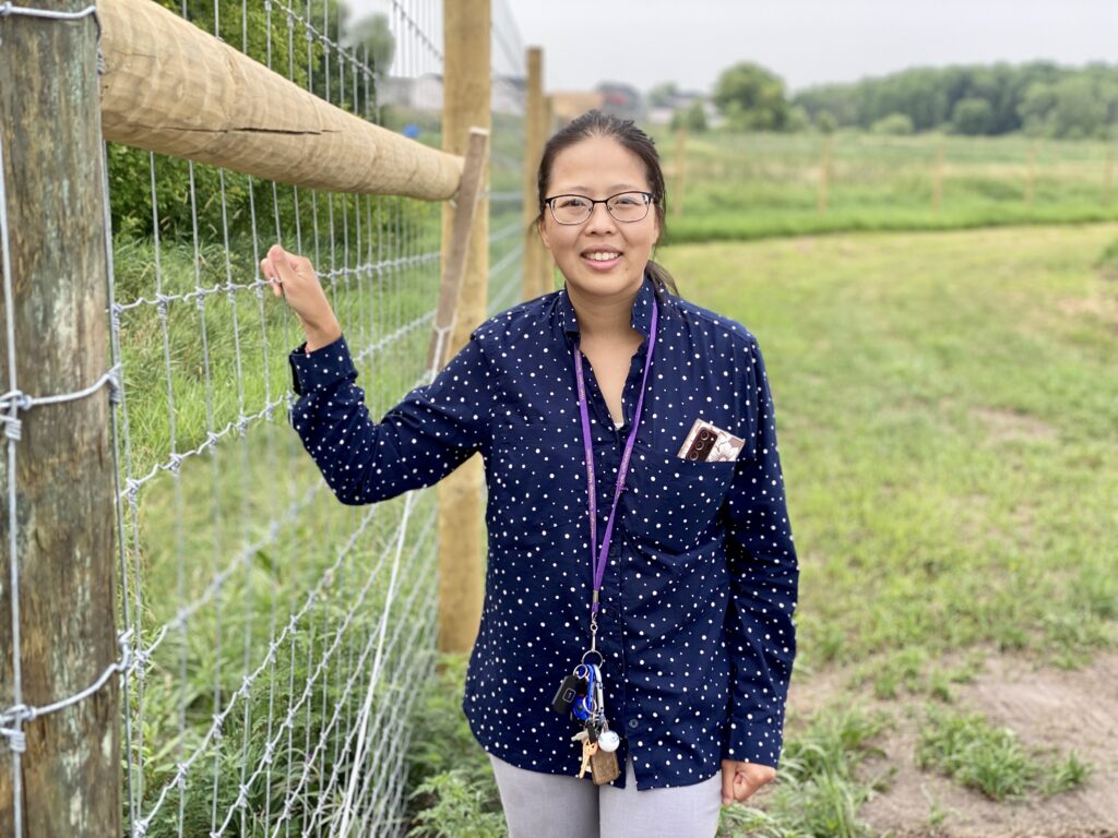 Mhonpaj Stands Alongside the New Fence